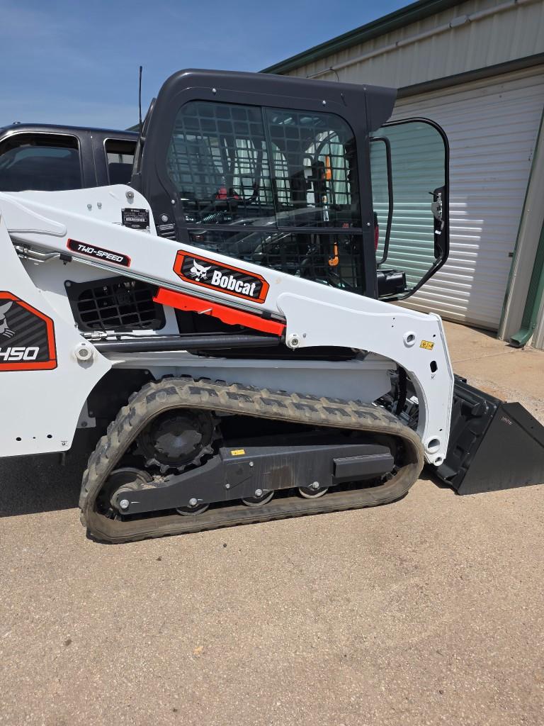 Side profile of Texas Best Sprinklers Bobcat T450 track loader