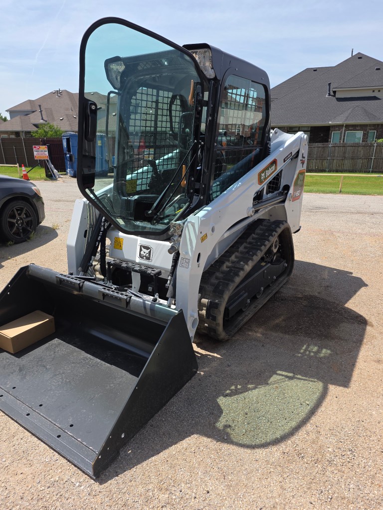 Texas Best Sprinklers Bobcat T450 compact track loader with bucket